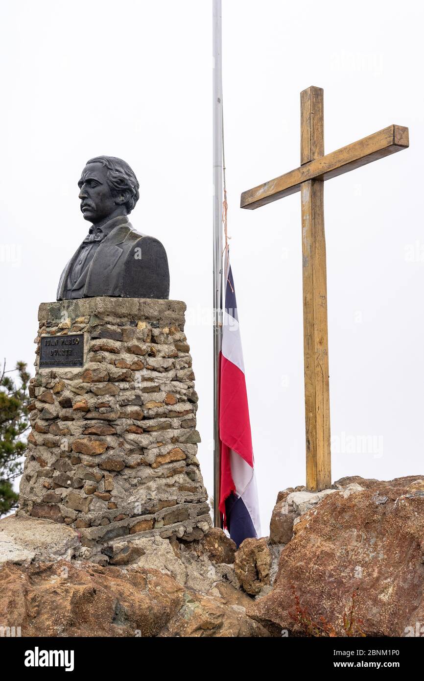 America, Caribbean, Greater Antilles, Dominican Republic, Jarabacoa, Manabao, Parque Nacional José Armando Bermúdez, Pico Duarte, summit cross, statue and Dominican flag on the summit of Pico Duarte Stock Photo