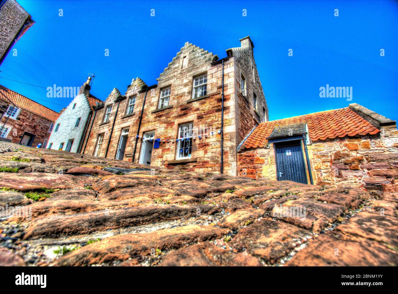 Town of Crail, Scotland. Artistic view of the cobbled King Street, near the fishing harbour in the Scottish town of Crail. Stock Photo