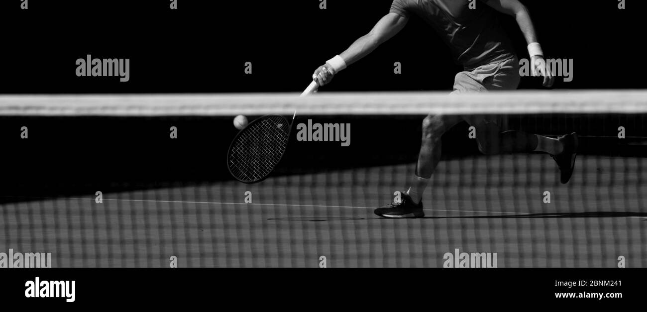 Tennis player and shadow on a tennis court Black and White Stock Photos ...
