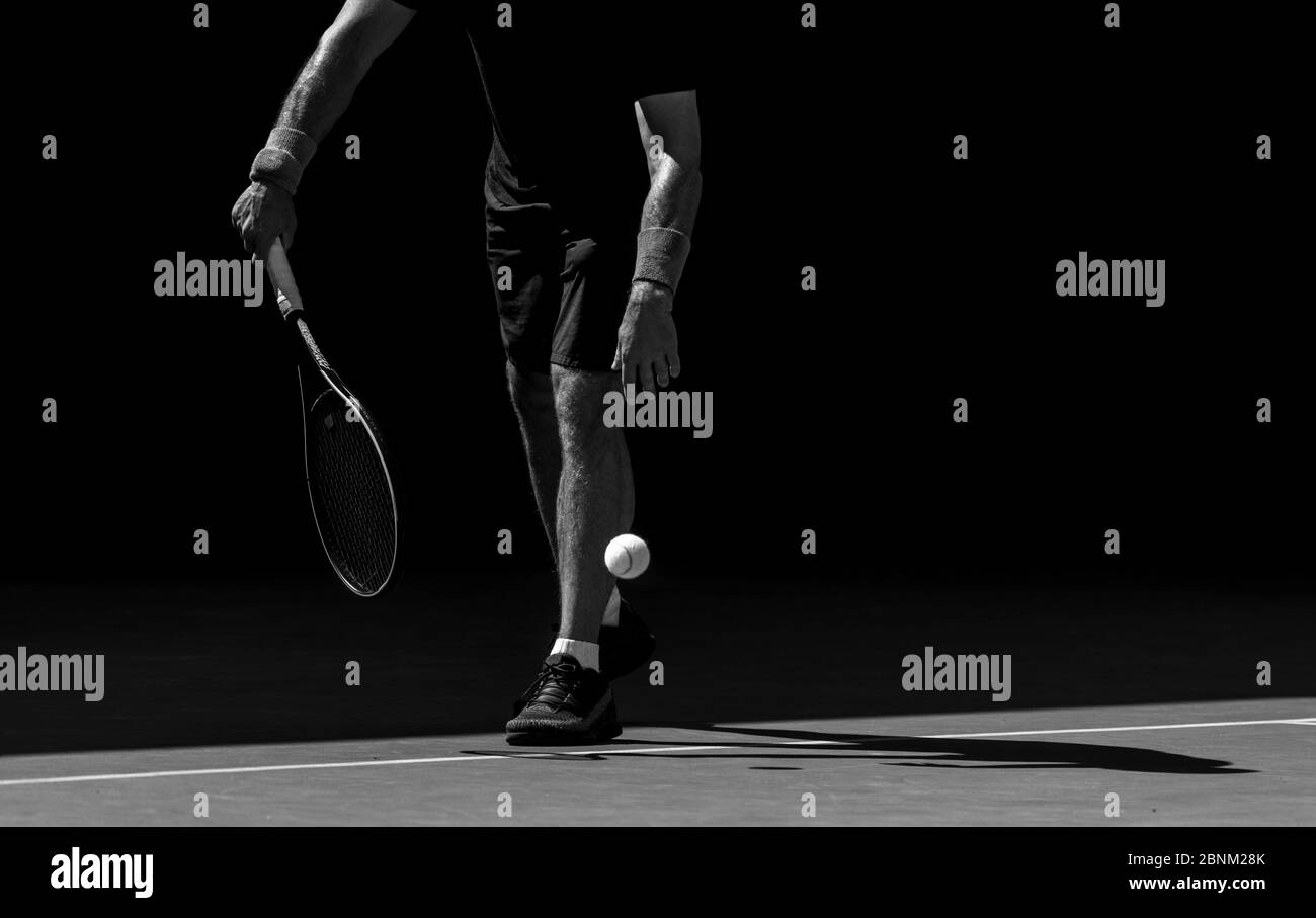 Tennis player and shadow on a tennis court Black and White Stock Photos ...