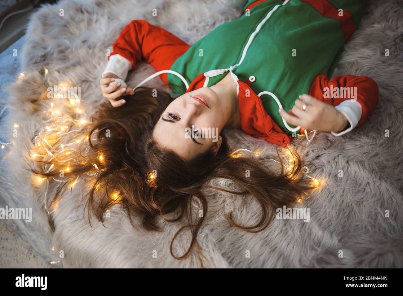 Happy girl lies on bed hi-res stock photography and images - Alamy