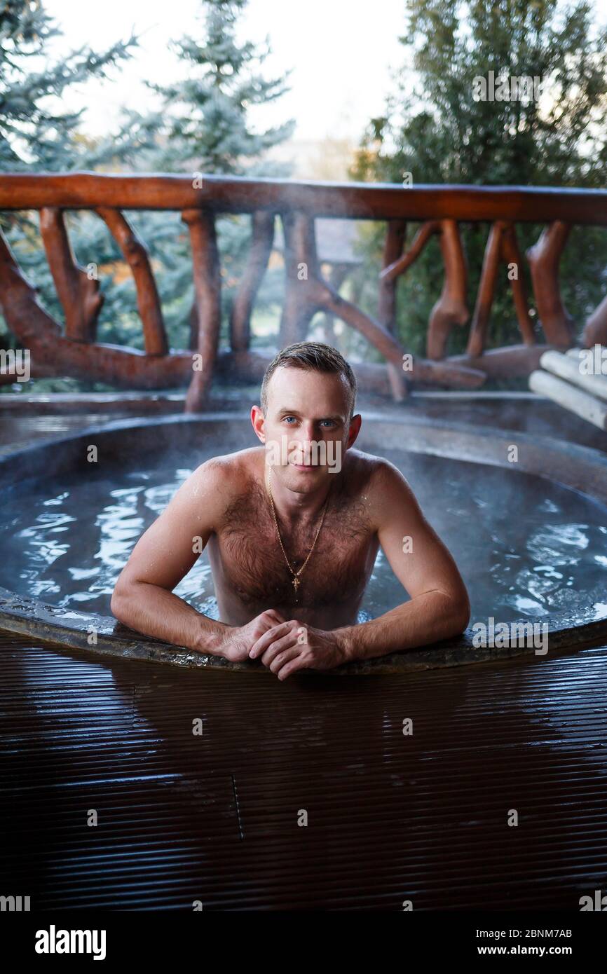 outdoor hot tub spa on Young Man In The Pool With Hot Water On The Terrace Spa Body Treatments Outdoor Jacuzzi Jacuzzi With A Guy Relax In The Open Air Cottage With Spa Stock Photo Alamy