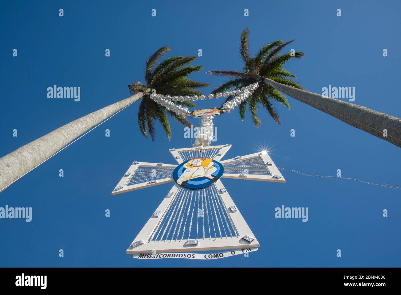 Vitoria, Espirito Santo, Brazil - April14, 2016:  Holy Cross hanging on palm trees in the Convent of Penha,  in Vitoria, the capital of Espirito Santo Stock Photo