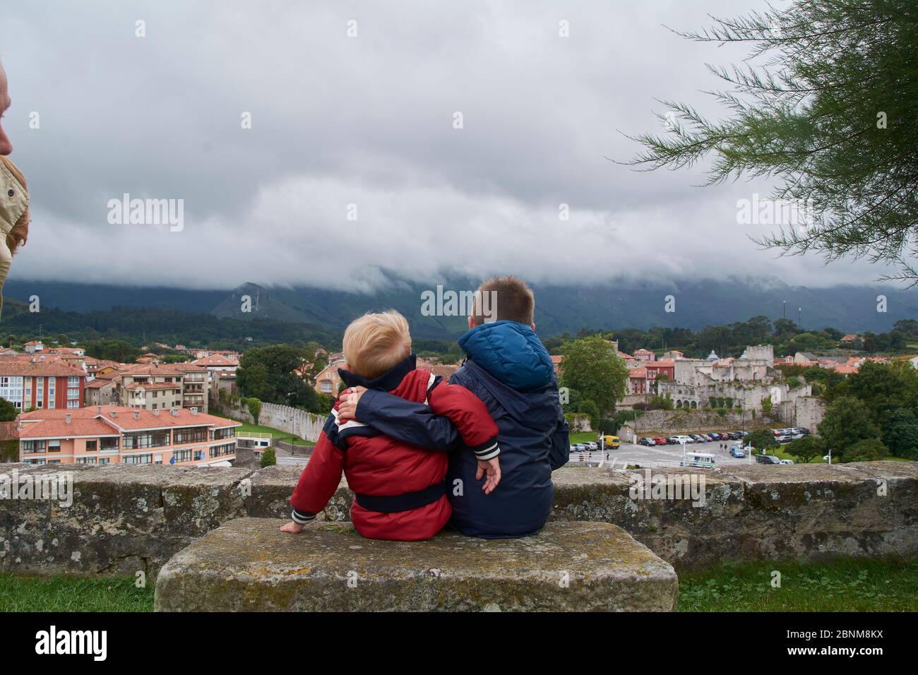 Two children watching the town after the storm. Brothers love Stock Photo