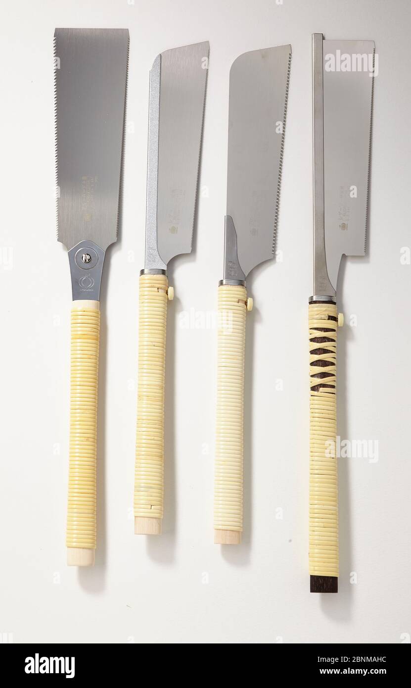 4 different Japanese saws side by side on white, series tool for working wood from Japan, Japanese tool for wood working, Stock Photo