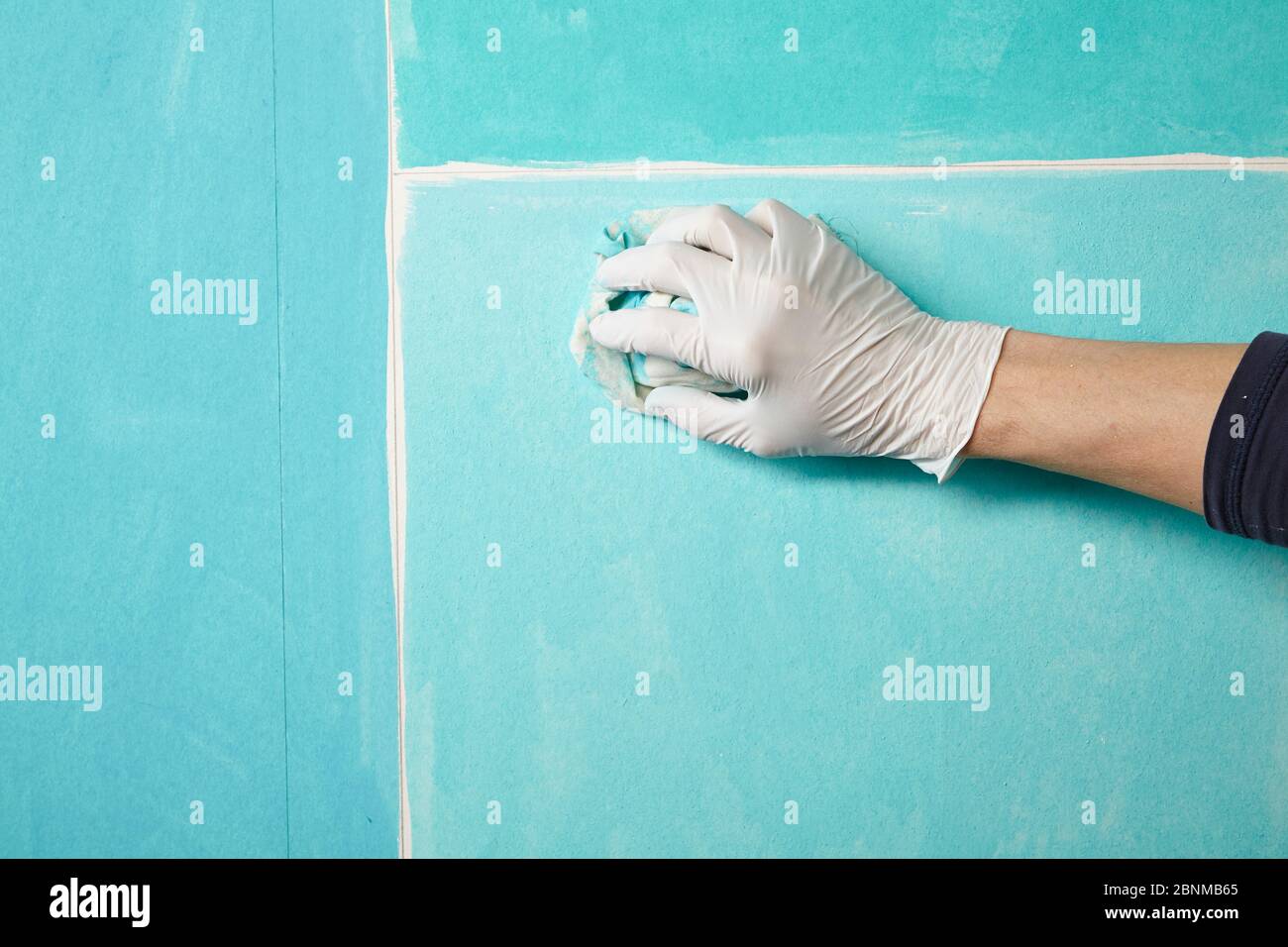 Wiping off excess paint hires stock photography and images Alamy