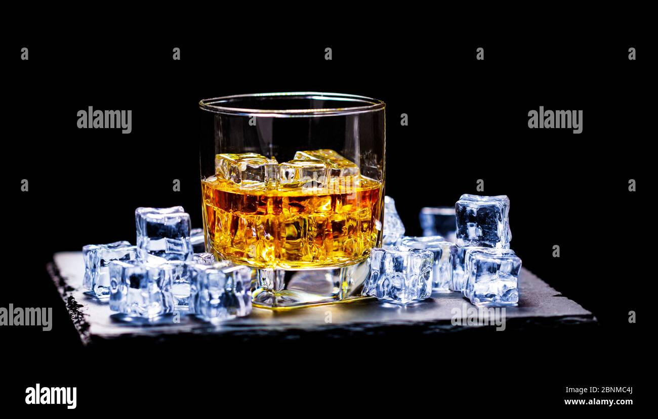 Whiskey On The Rocks, whiskey glass, ice cubes, slate Stock Photo - Alamy