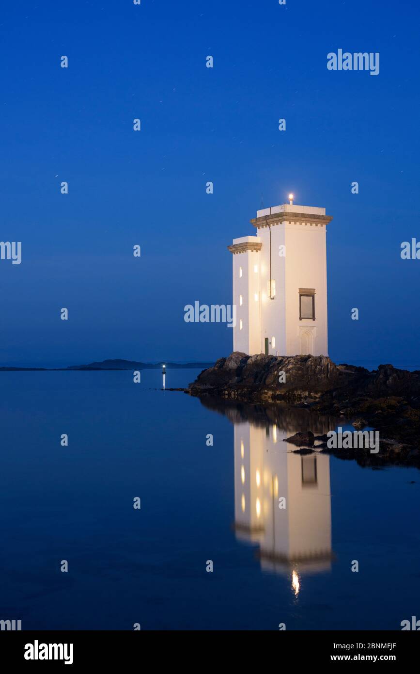 Carraig Fhada lighthouse at night, Islay, Scotland, UK, June. Stock Photo