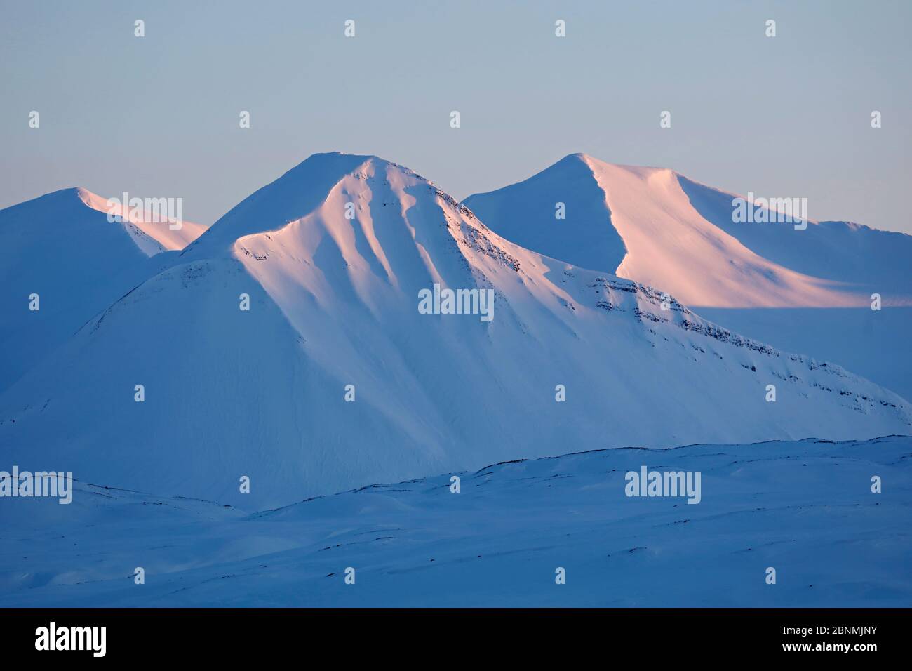 Mountains in Winter at sunset, Spitsbergen, Svalbard, Norway, April Stock Photo