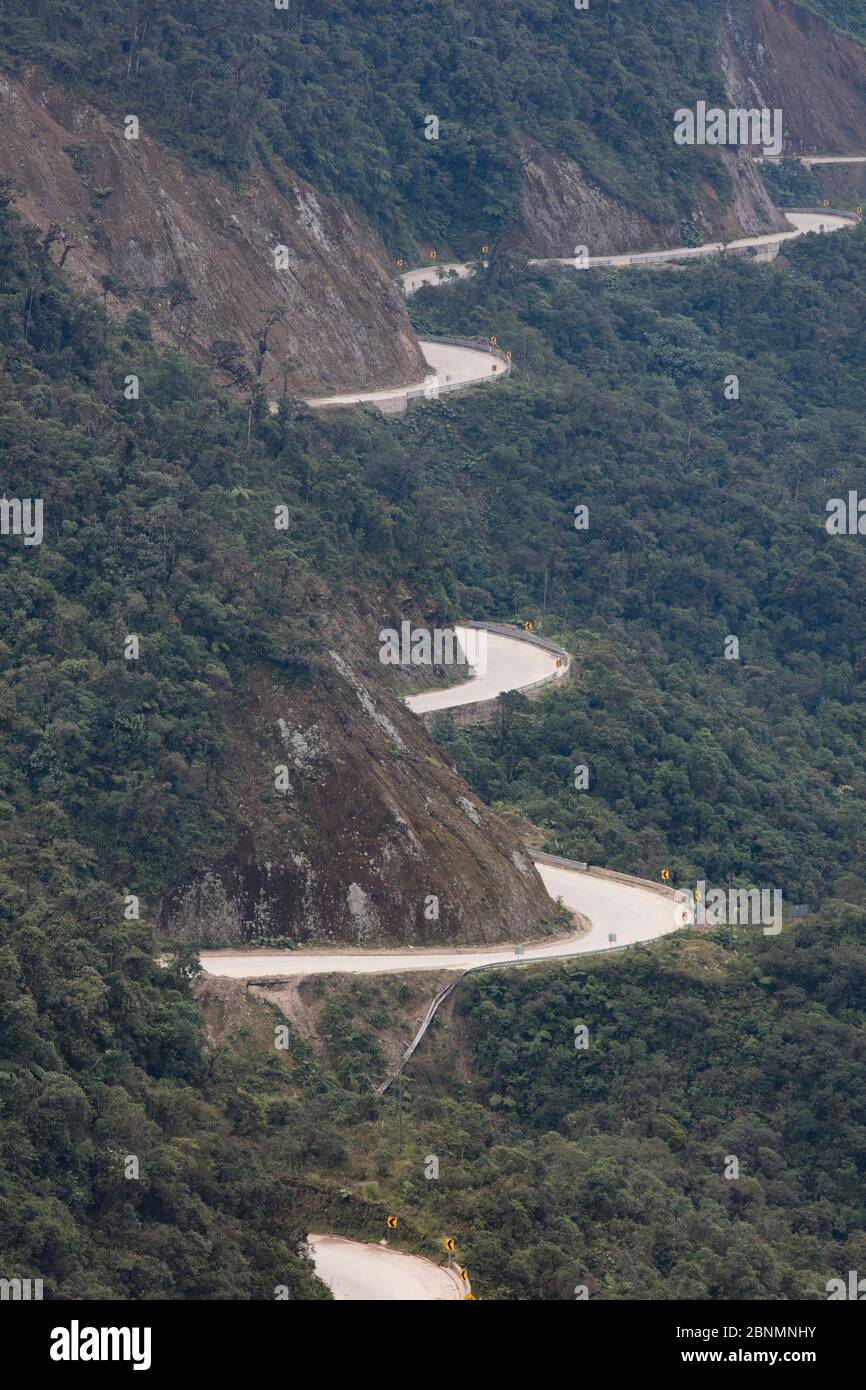 Andean highway snaking way through hills inside Tapichalaca Reserve, Province Zamora-Chinchipe, Ecuador Stock Photo