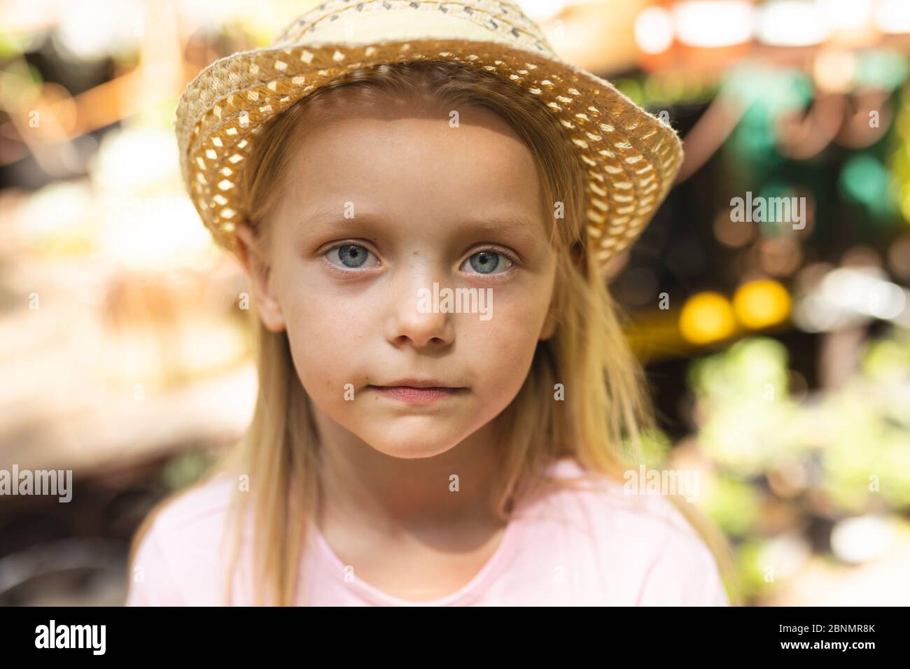 Girl with a straw hat hi-res stock photography and images - Alamy