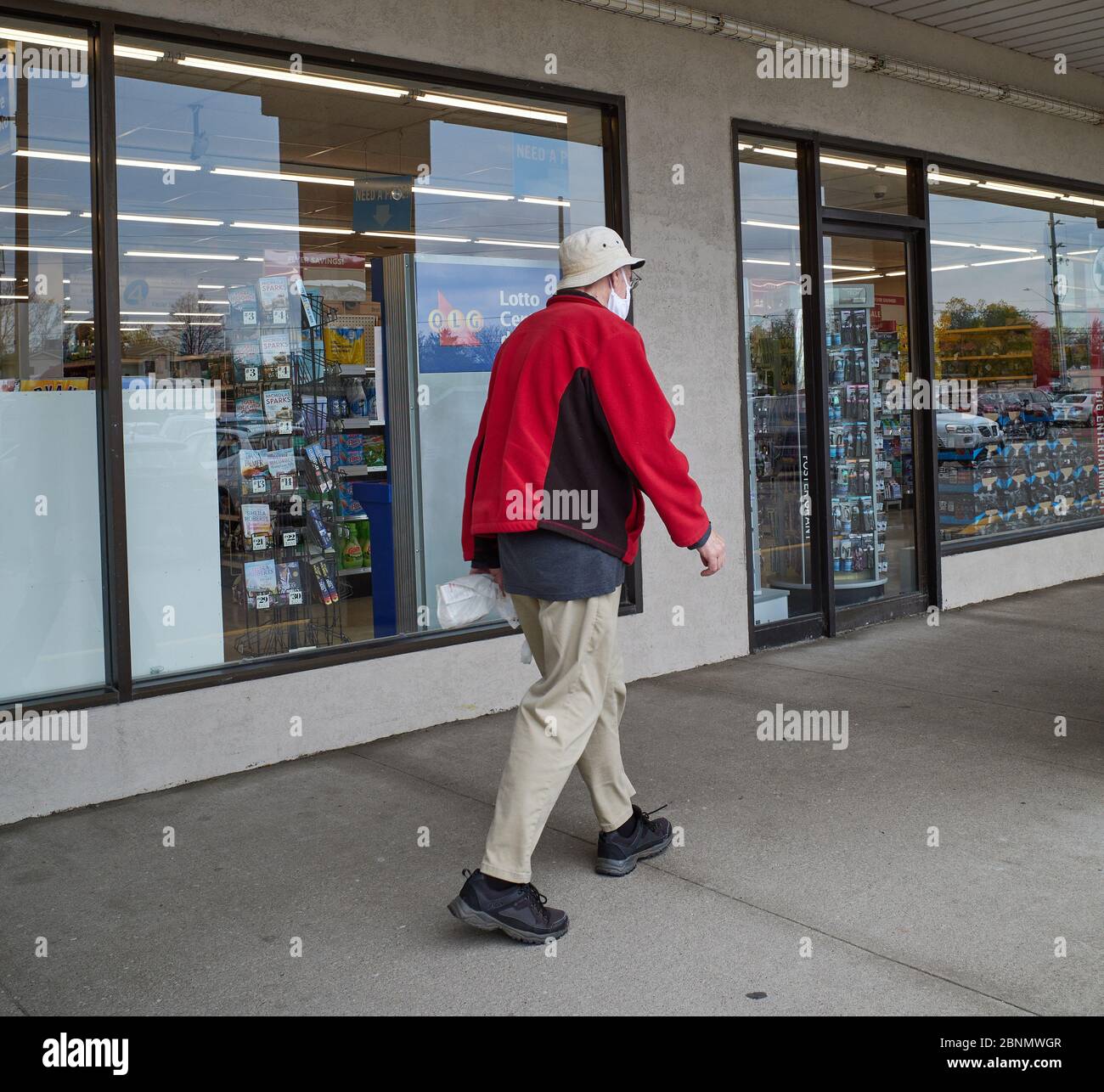 Man wears mask walks hi-res stock photography and images - Alamy