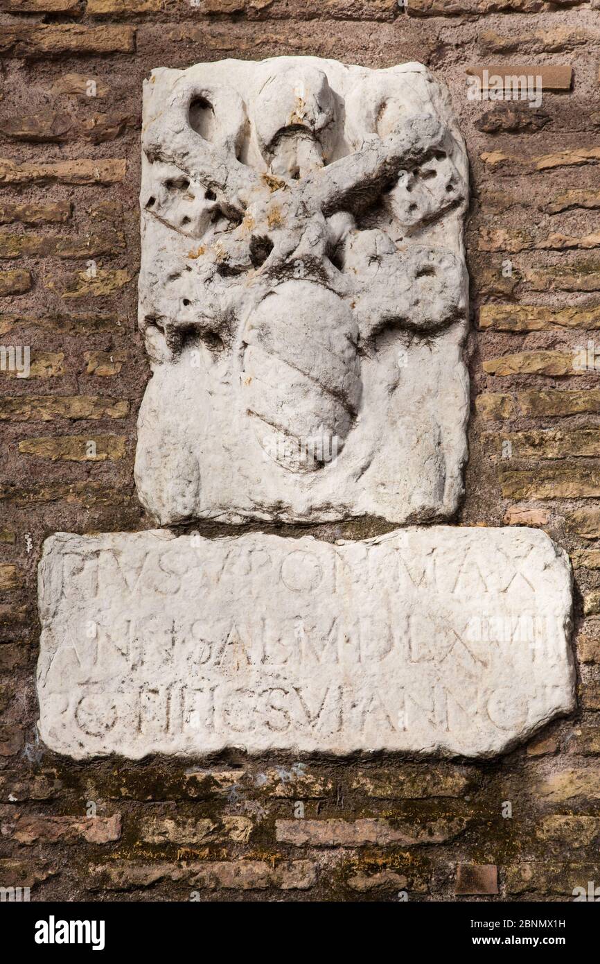Coat of Arms set into the old Roman city wall close to the Vatican in Rome Stock Photo