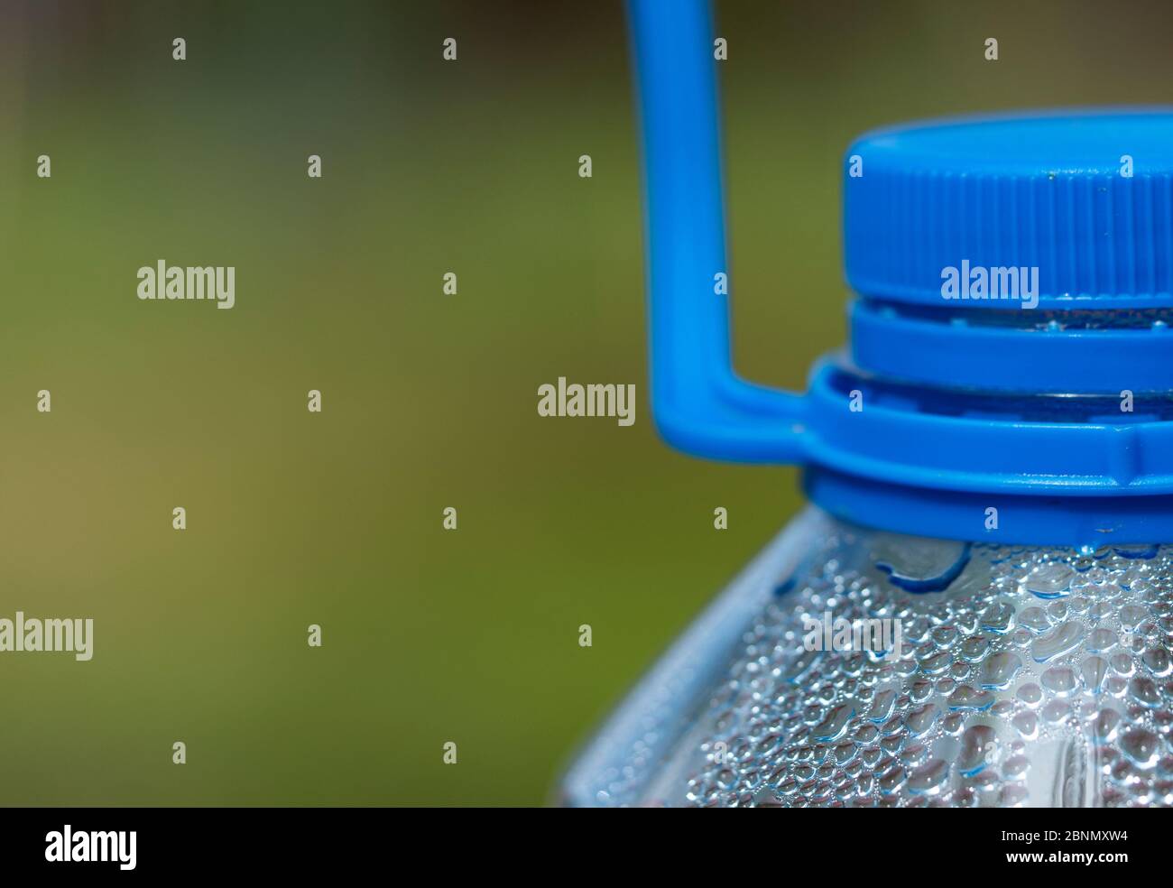 Top part of a five liter plastic bottle, coated inside with condensate Stock Photo