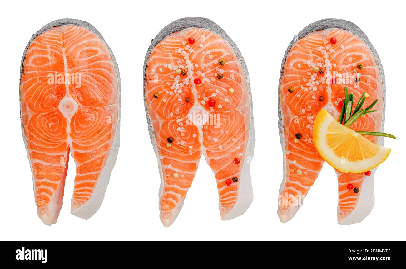 Collection of raw salmon steaks isolated on white background. Top view ...