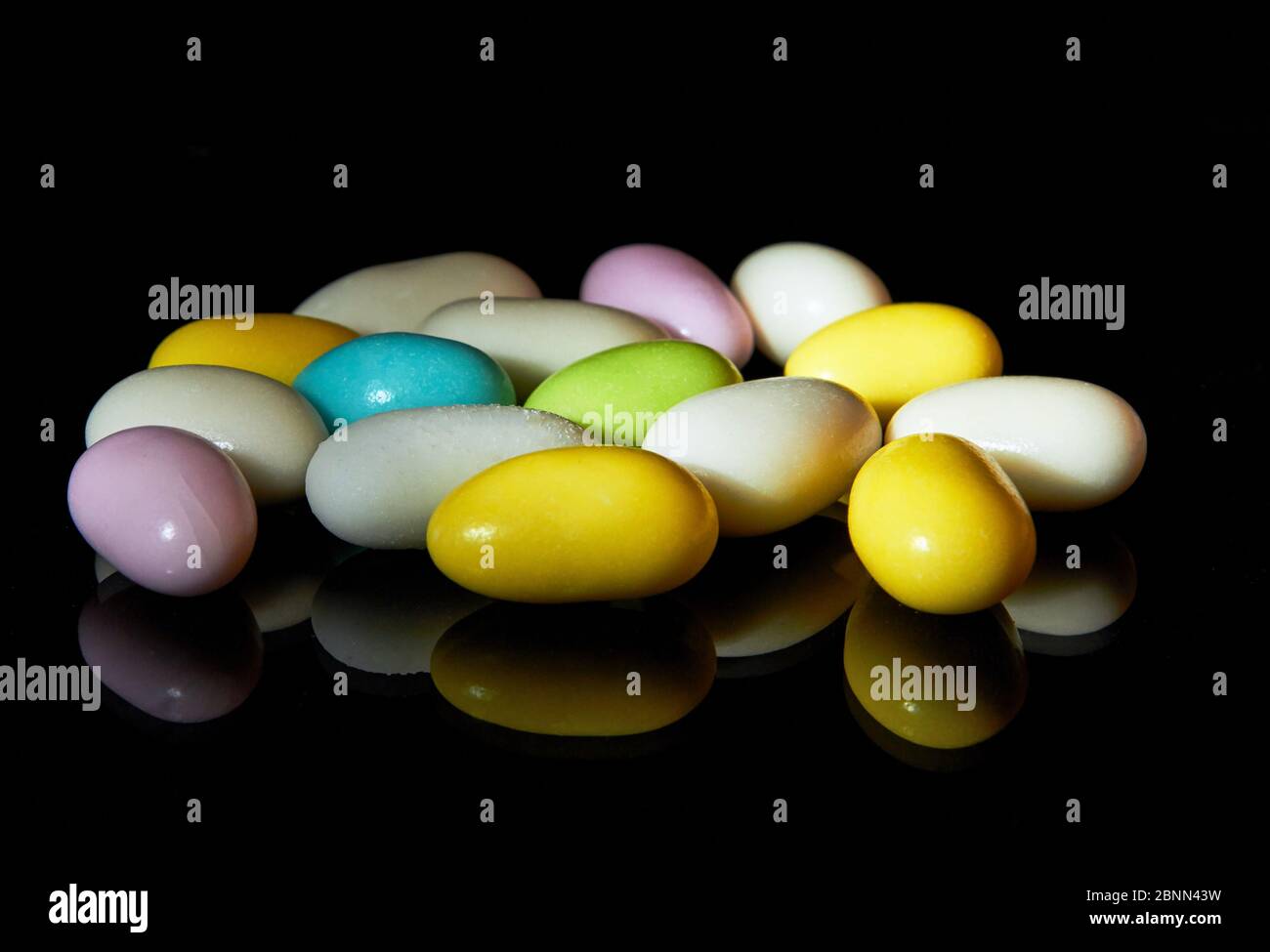 Multi colored candies isolated on black background Stock Photo