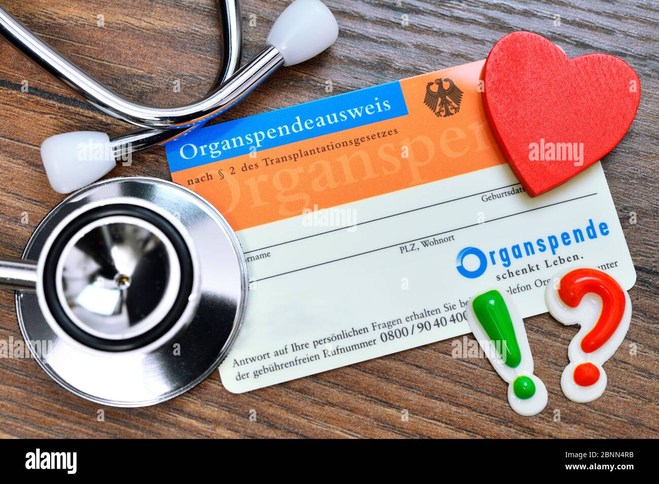 Organ donation card with stethoscope, heart, exclamation mark and