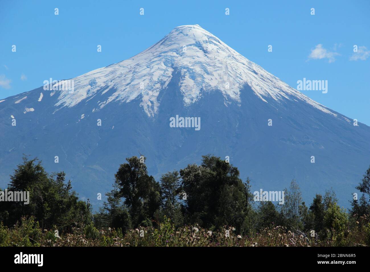 Snow capped Osorno Volcano in the summer sunshine in Chile Stock Photo