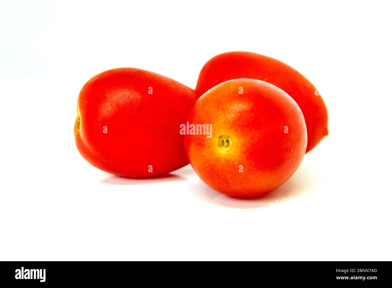 Cherry tomatoes isolated on white background side view Stock Photo - Alamy
