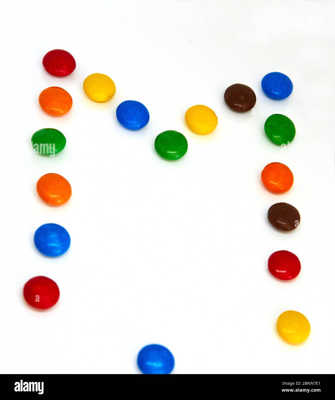 colorful chocolate buttons on a white background Stock Photo