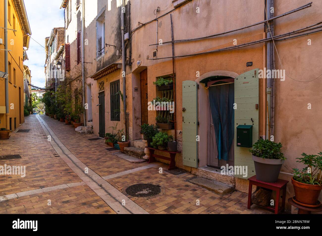 A colorful pedestrian alleyway in the picturesque resort town of Cassis in  Southern France Stock Photo