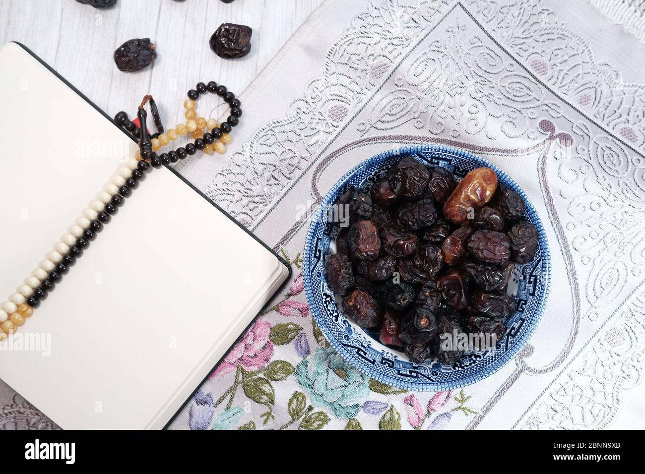 the concept of ramadan, a bowl of date fruit on table  Stock Photo