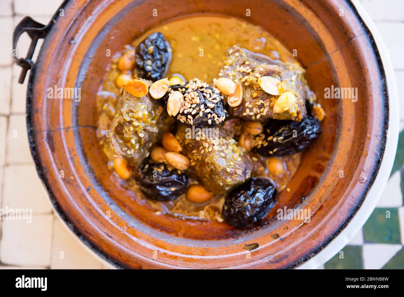 Beef tagine with prunes, almonds and sesame seeds Stock Photo Alamy