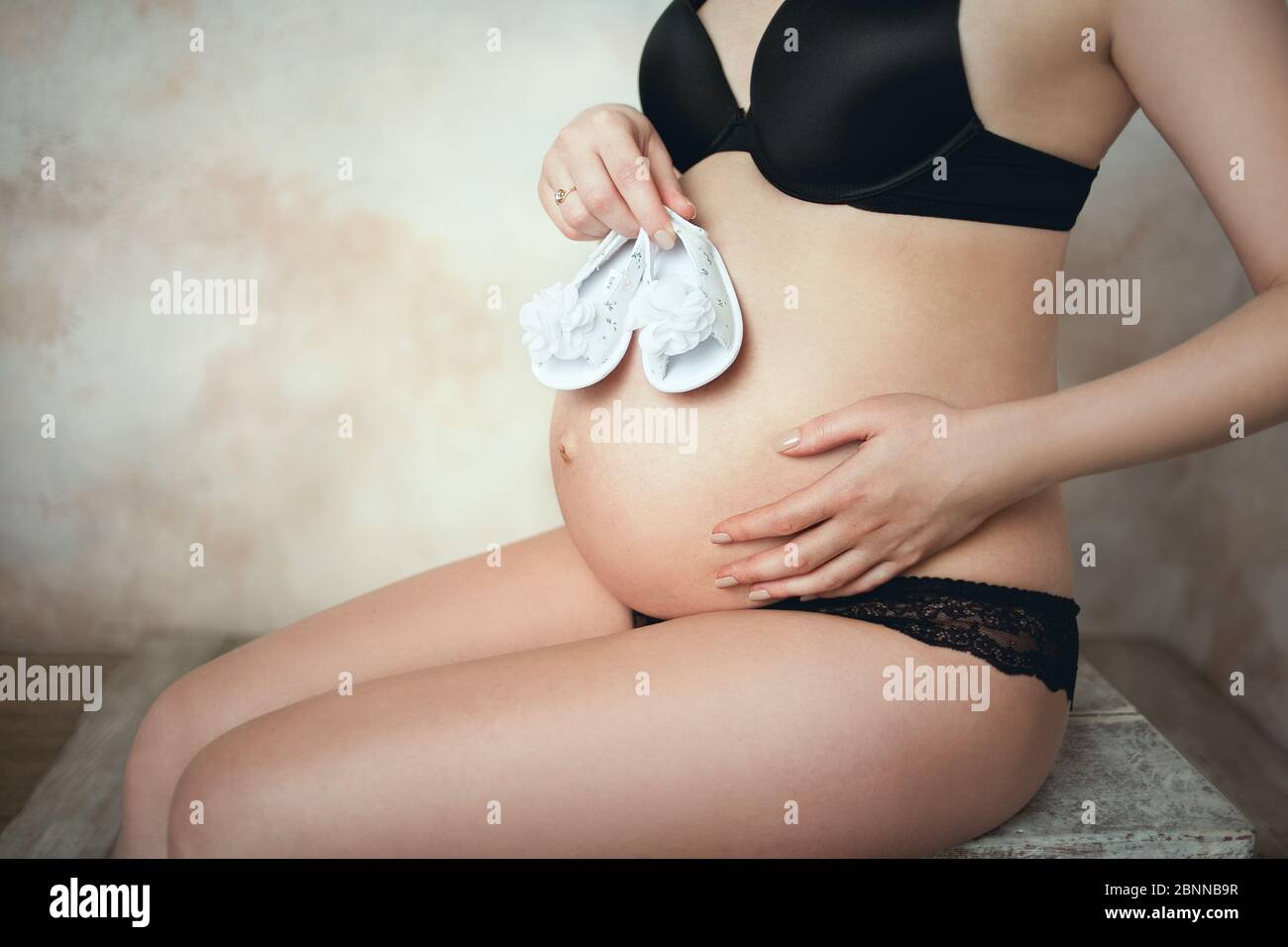 Belly of a pregnant girl Stock Photo