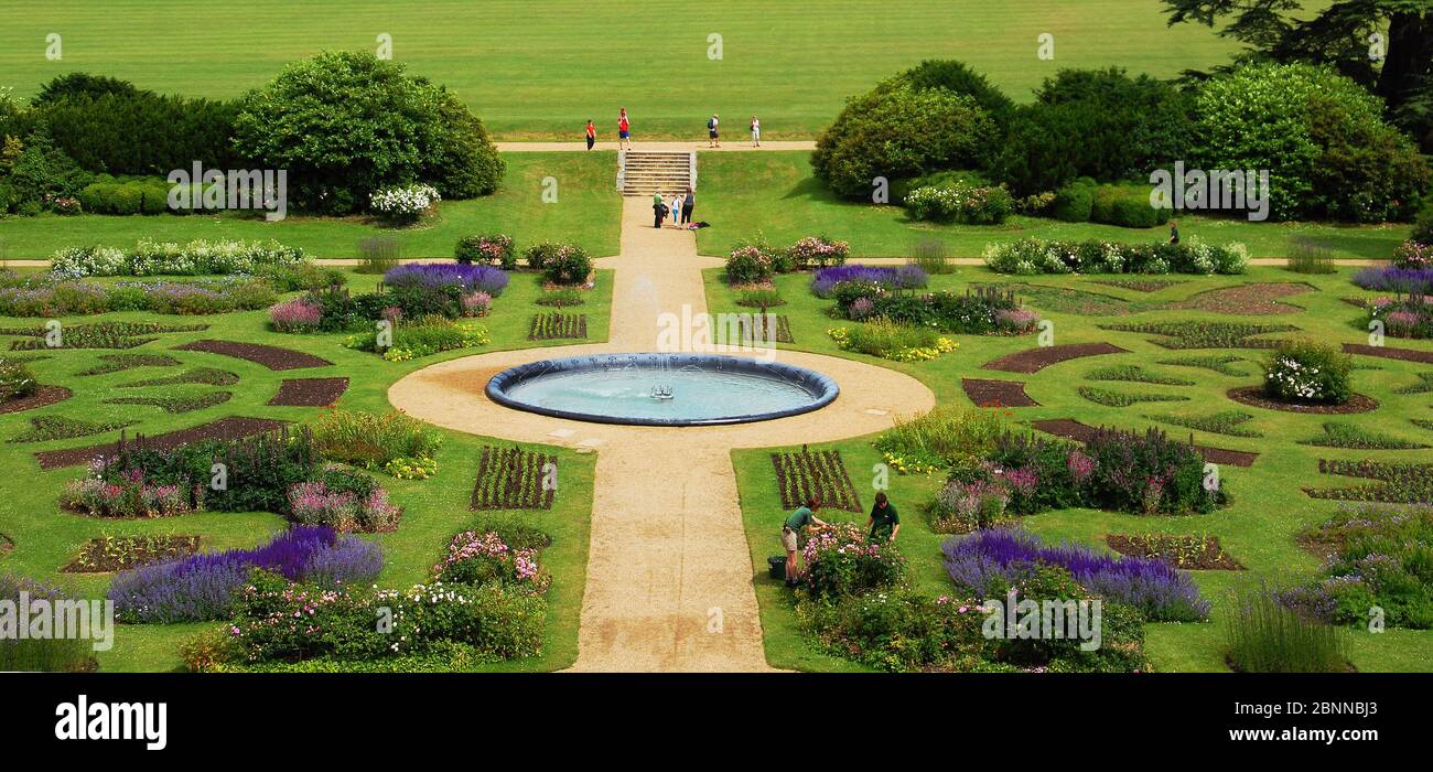 Setting the Stage - gardeners tend the flower garden parterre at Audley End, a historic house in Essex Stock Photo