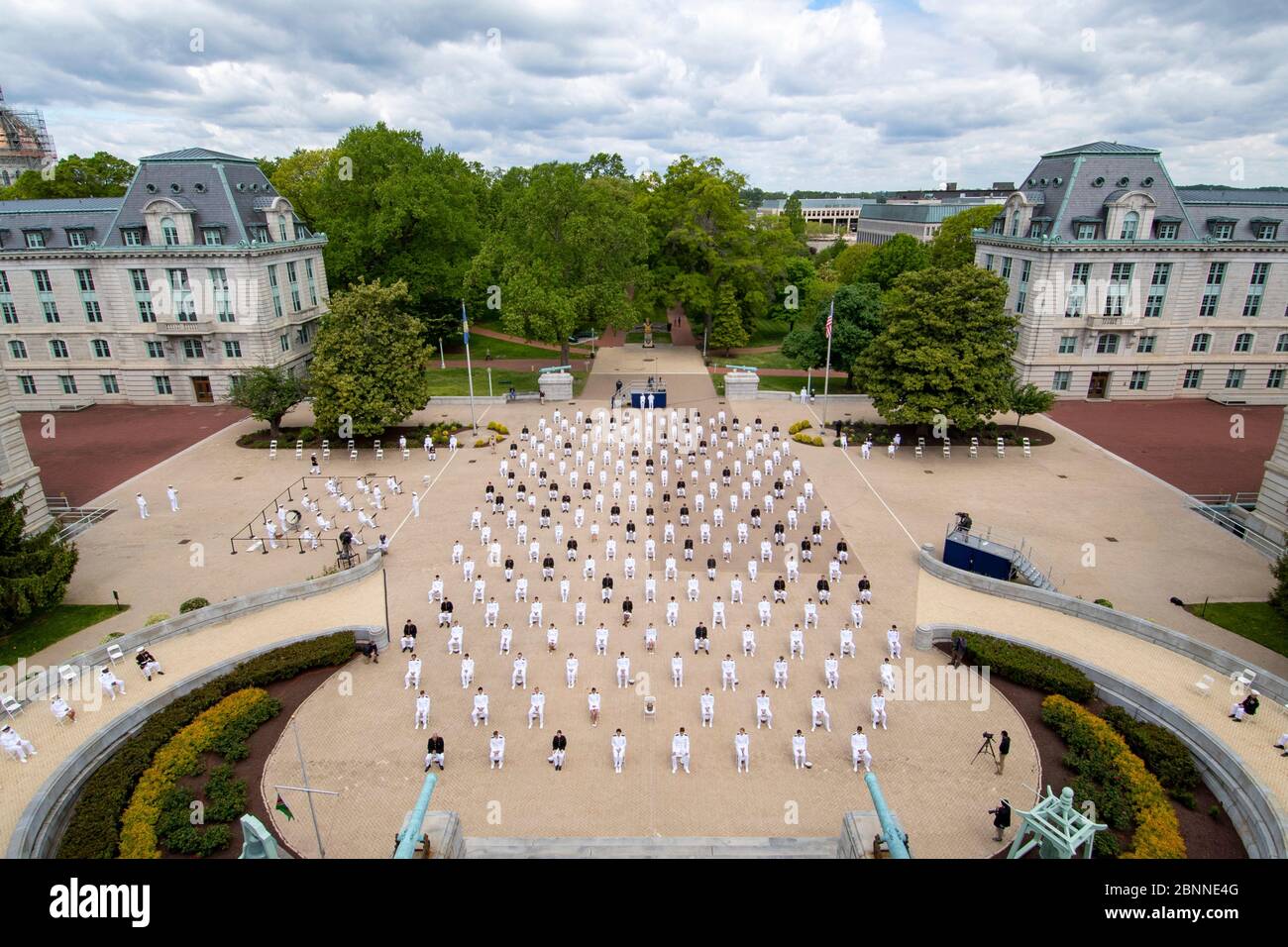 U.S Naval Academy graduates during the 2020 graduation and commissioning ceremony under COVID-19, coronavirus pandemic social distancing rules May 12, 2020 in Annapolis, Maryland. Approximately 1,000 midshipmen will graduate and be sworn-in during five events and one virtual ceremony. Stock Photo