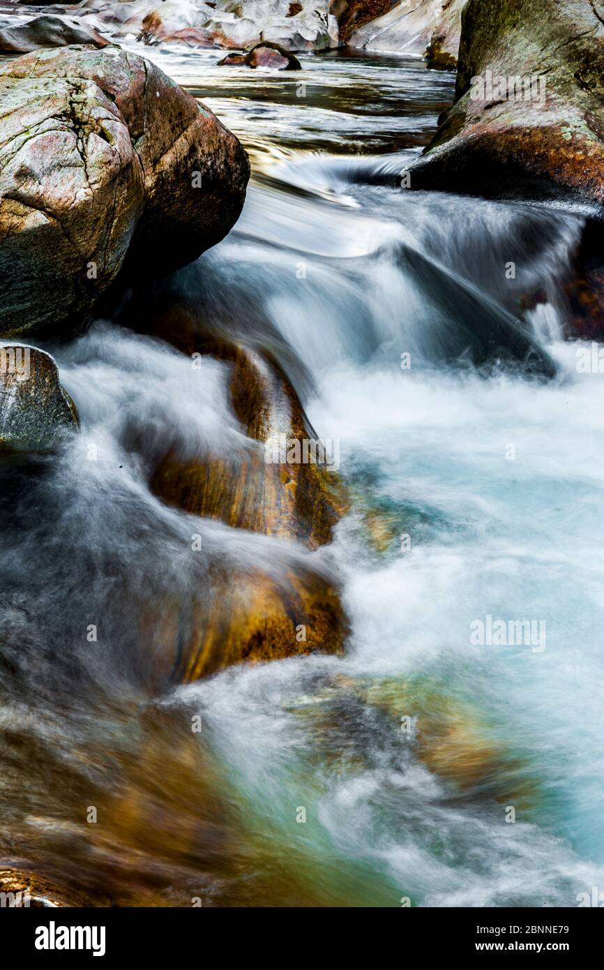 Flowing water in a mountain stream Stock Photo