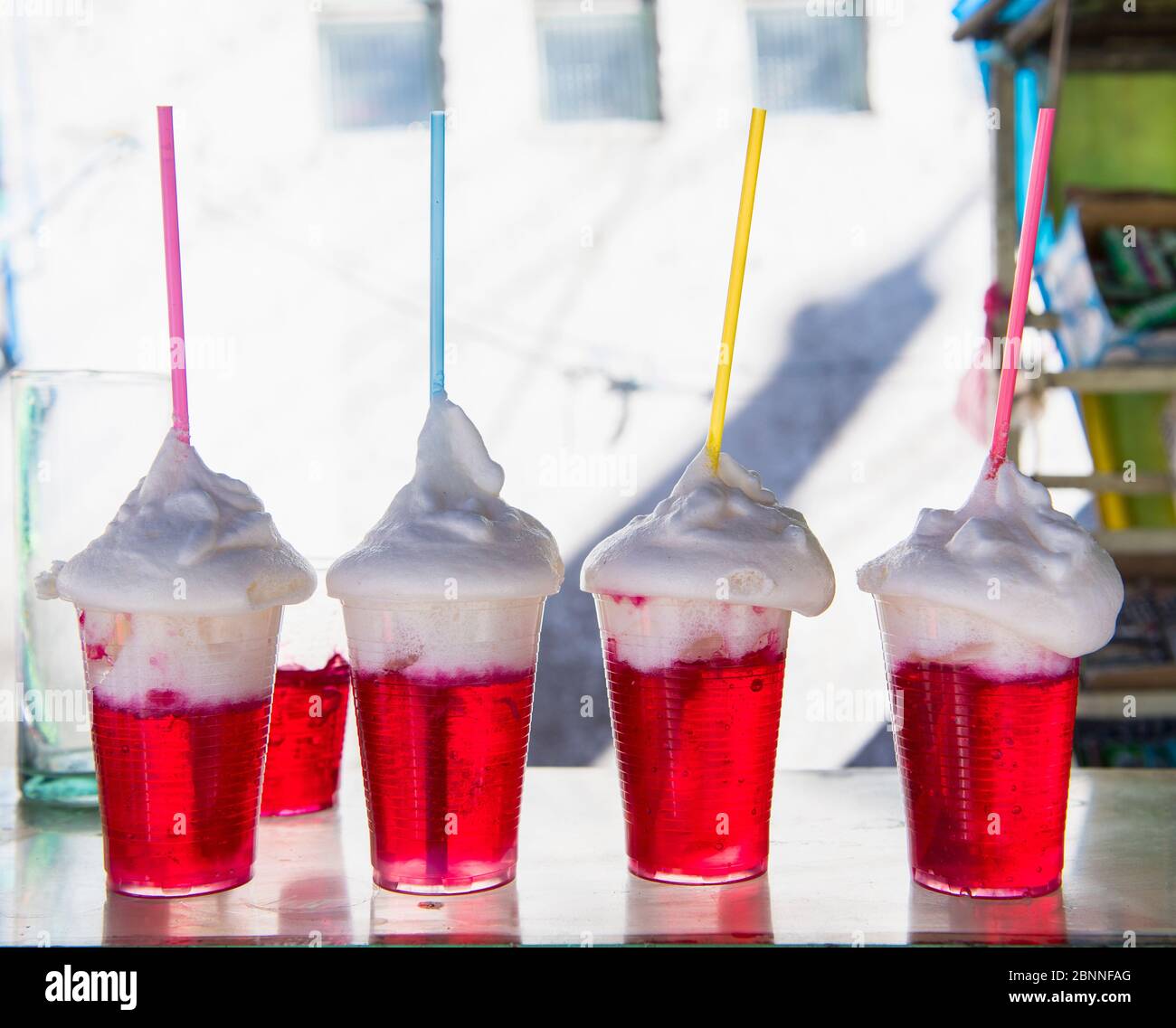 Row of red gelatin with whipped cream desserts, Potosi, Bolivia Stock