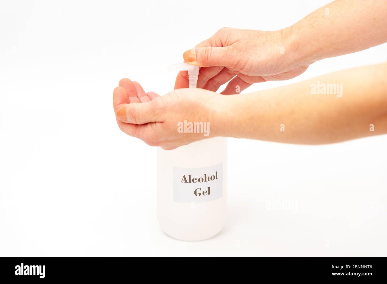 Hands using alcohol gel to protect against coronavirus (COVID-19) and ...