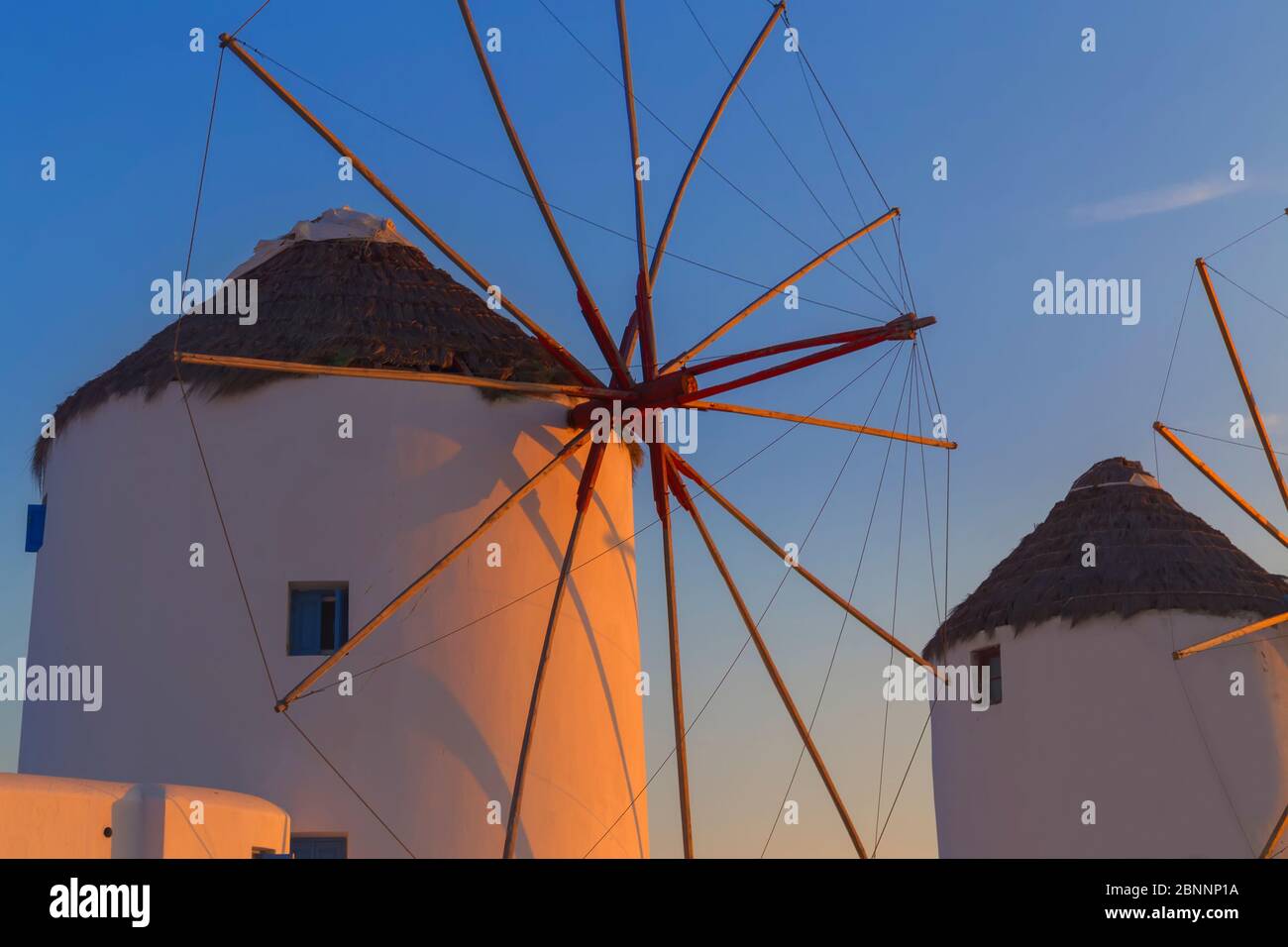Windmills Kato Mili at sunset, Mykonos Town, Mykonos, Cyclades Islands, Greece Stock Photo