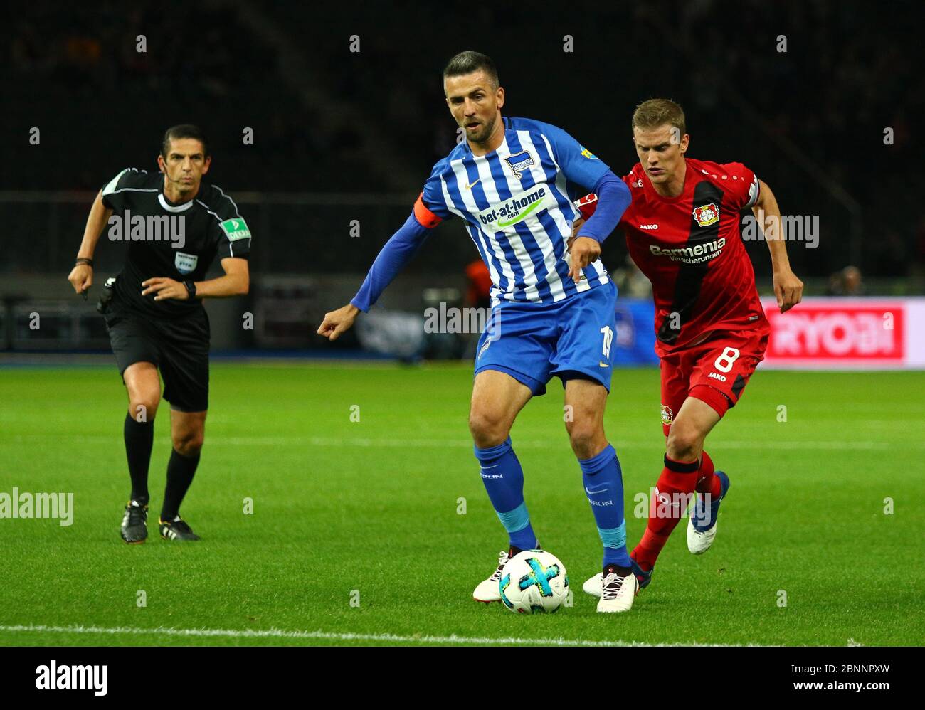 Berlin, Germany - September 20, 2017: Vedad Ibisevic of Hertha BSC Berlin (L) fights for a ball with Lars Bender of Bayer 04 Leverkusen during their German Bundesliga game at Olympiastadion Berlin Stock Photo