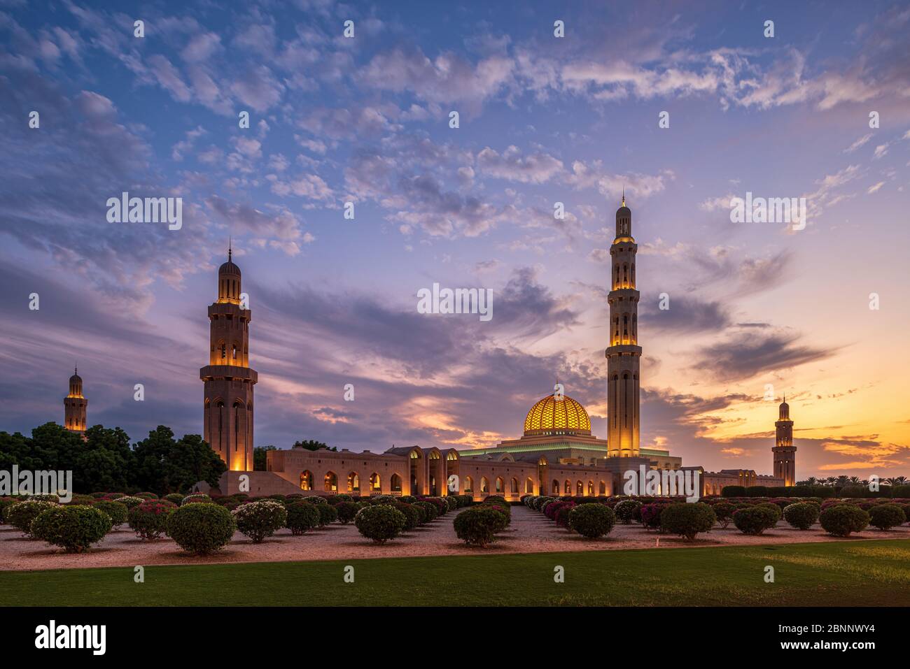 Mosque, house of prayer, dome, minaret, park, garden, dusk, lighting, evening sky, clouds, cloudscape, trees Stock Photo