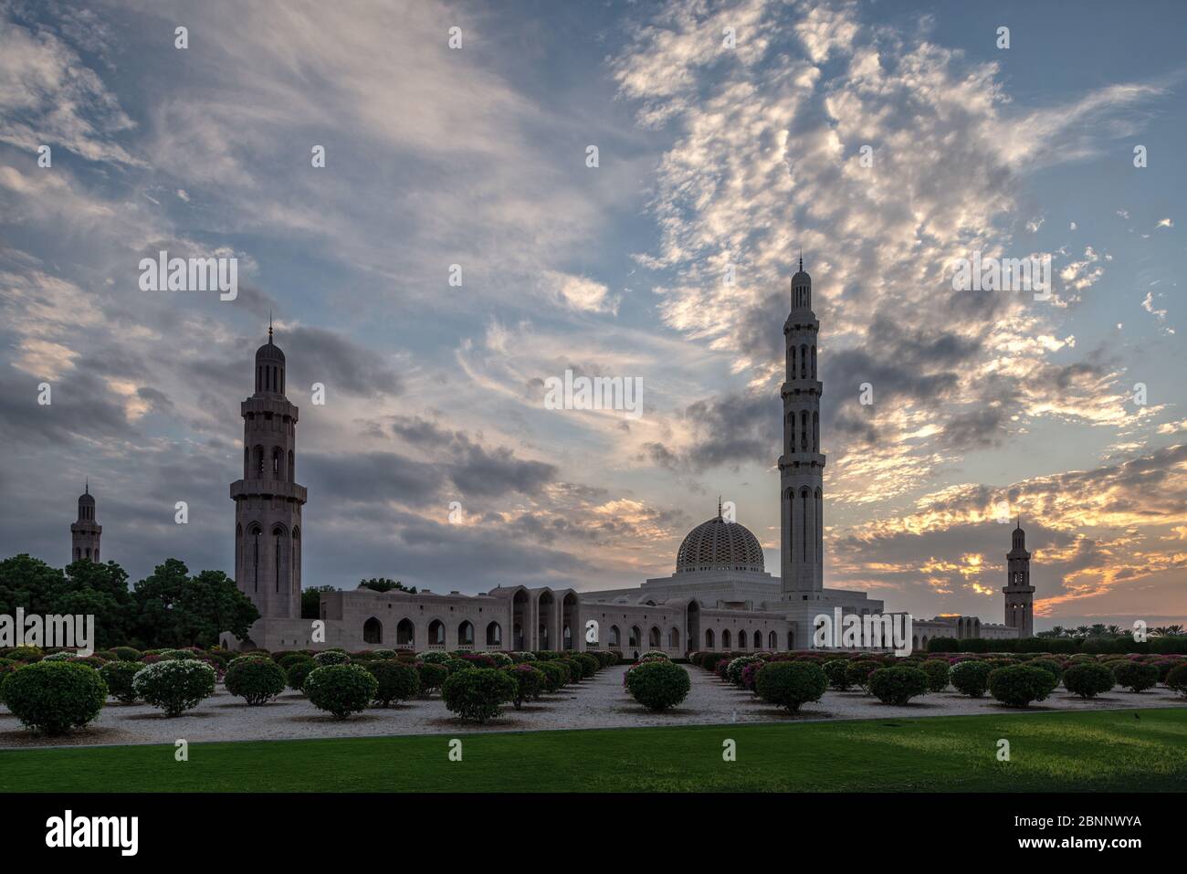 Mosque, house of prayer, dome, minaret, park, garden, dusk, evening sky, clouds, cloudscape, trees Stock Photo
