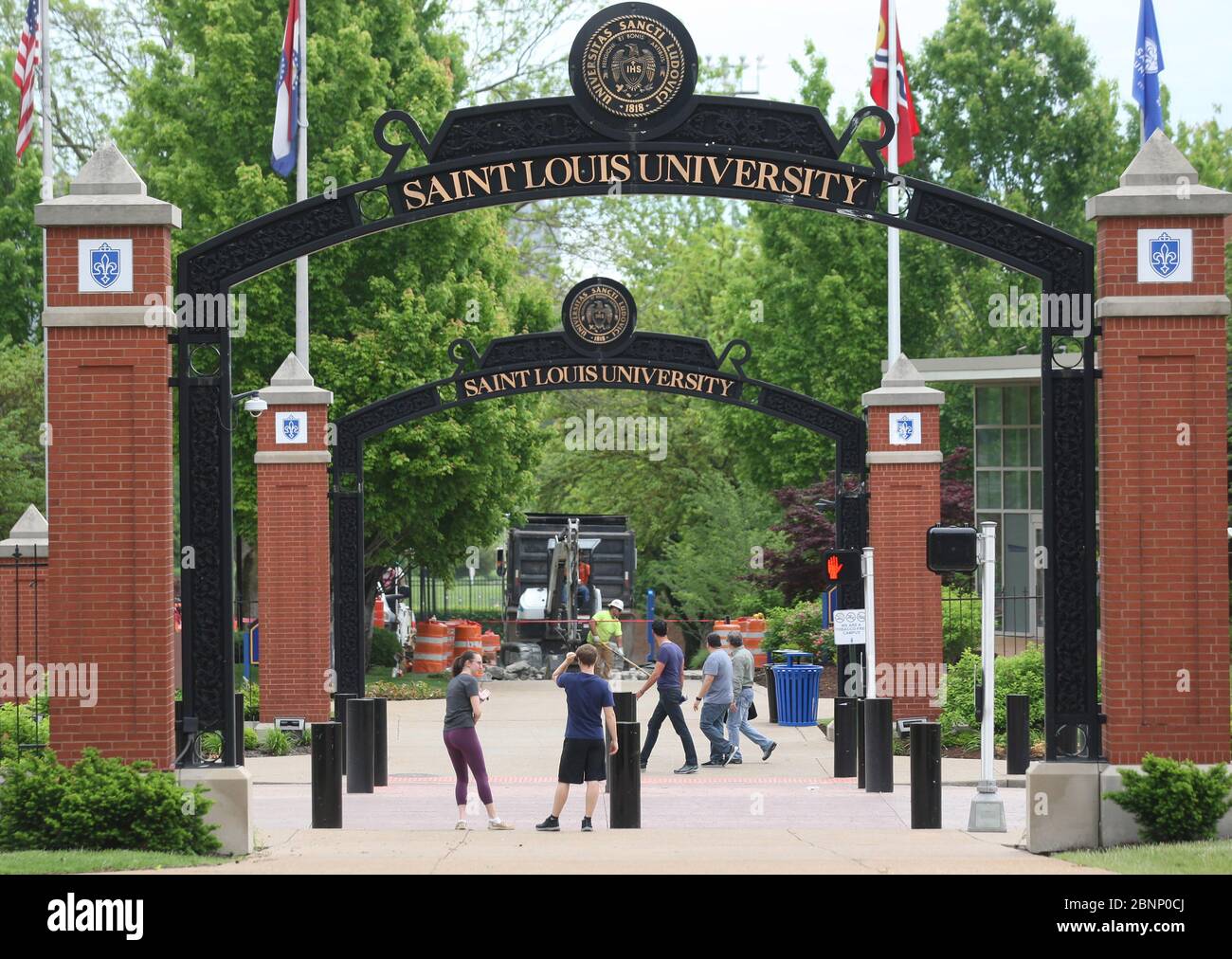 St. Louis, United States. 15th May, 2020. Students try to cross Grand Avenue during summer break at Saint Louis University in St. Louis on Friday, May 15, 2020. The university has announced that standardized tests will be optional for the admissions process in fall 2021. Saint Louis University said that the fall 2021 class is challenged by test date cancellations during the COVID-19 pandemic, making it impractical to require SAT and ACT scores. Photo by Bill Greenblatt/UPI Credit: UPI/Alamy Live News Stock Photo