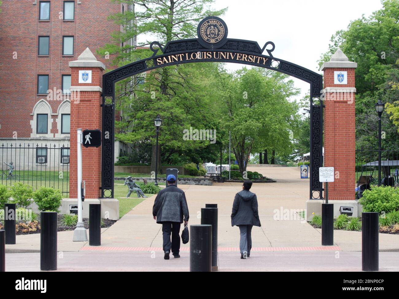 St. Louis, United States. 15th May, 2020. Students cross Grand Avenue during summer break at Saint Louis University in St. Louis on Friday, May 15, 2020. The university has announced that standardized tests will be optional for the admissions process in fall 2021. Saint Louis University said that the fall 2021 class is challenged by test date cancellations during the COVID-19 pandemic, making it impractical to require SAT and ACT scores. Photo by Bill Greenblatt/UPI Credit: UPI/Alamy Live News Stock Photo