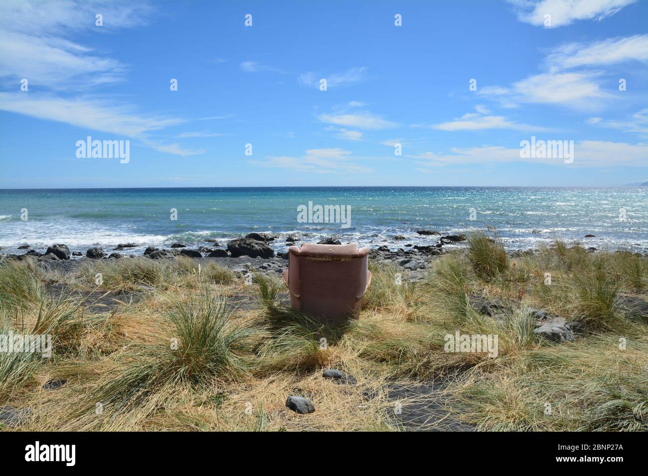 chair on the beacht, Cape Palliser, New Zealand Stock Photo
