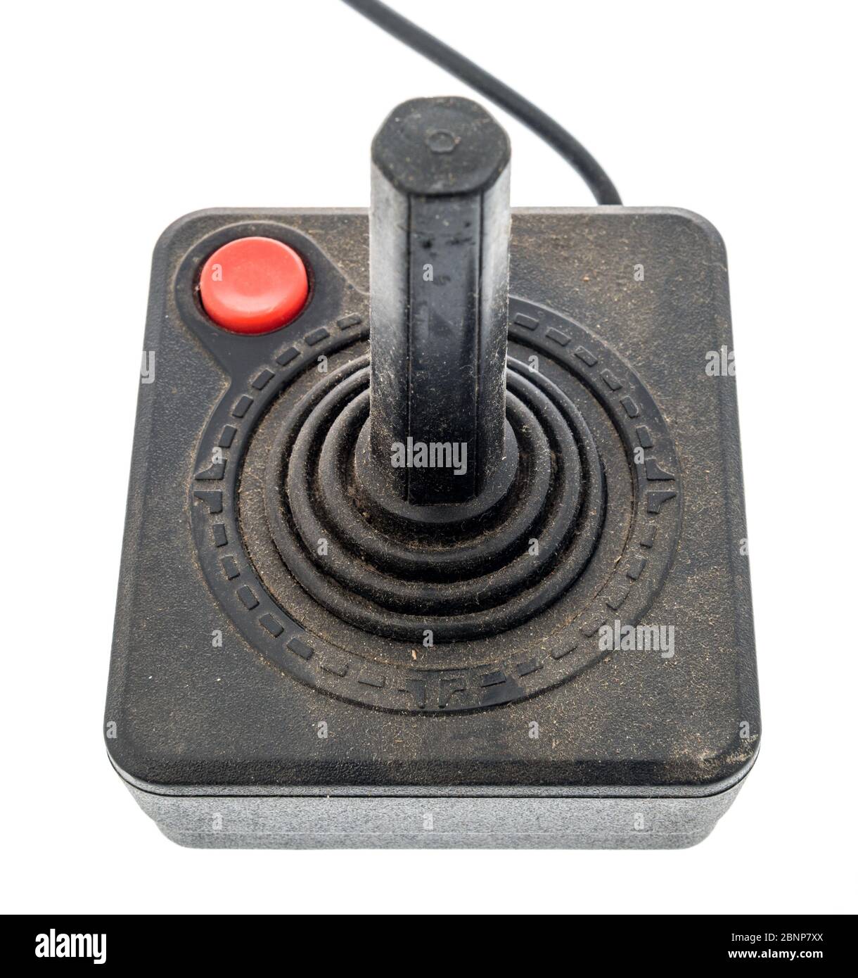 Winneconne,  WI - 5 May 2020:  A package of Atari 2600 joystick controller covered with dust on an isolated background Stock Photo