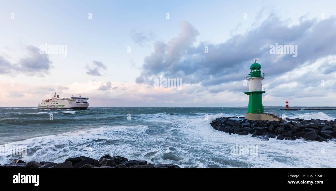 Germany, Mecklenburg-West Pomerania, Baltic Sea, Baltic coast, Warnemünde, seaside resort, pier fire, lighthouse, ferry, storm, waves, spray, sea Stock Photo