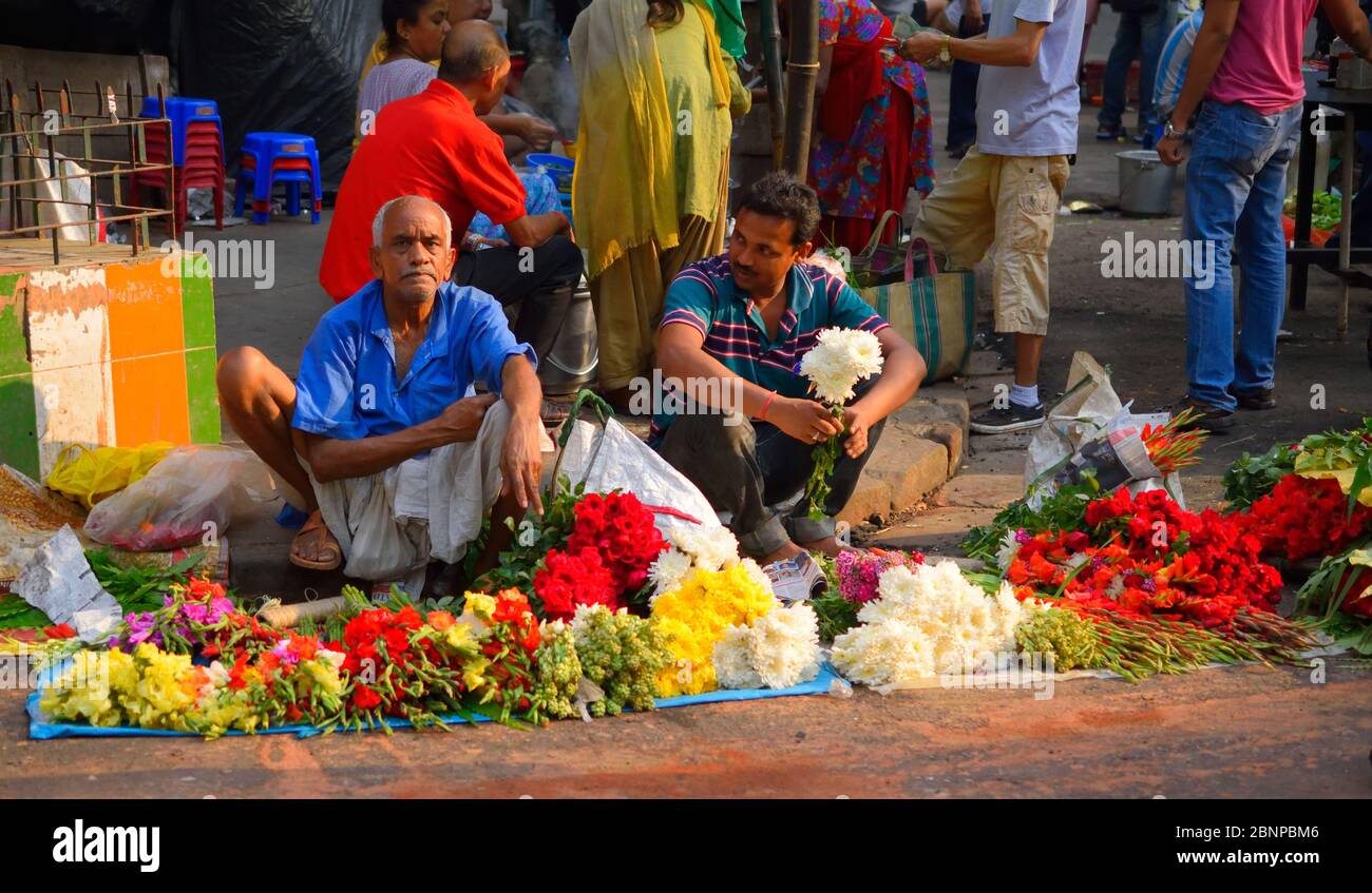 Street vendors selling flowers by the roadside Stock Photo Alamy