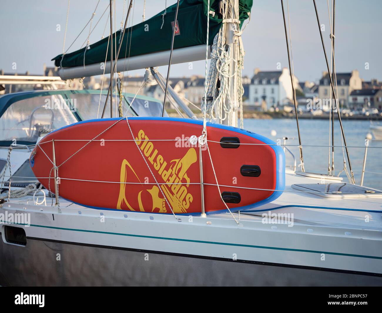 A ship in the evening sun in the old port of Roscoff in Brittany with a