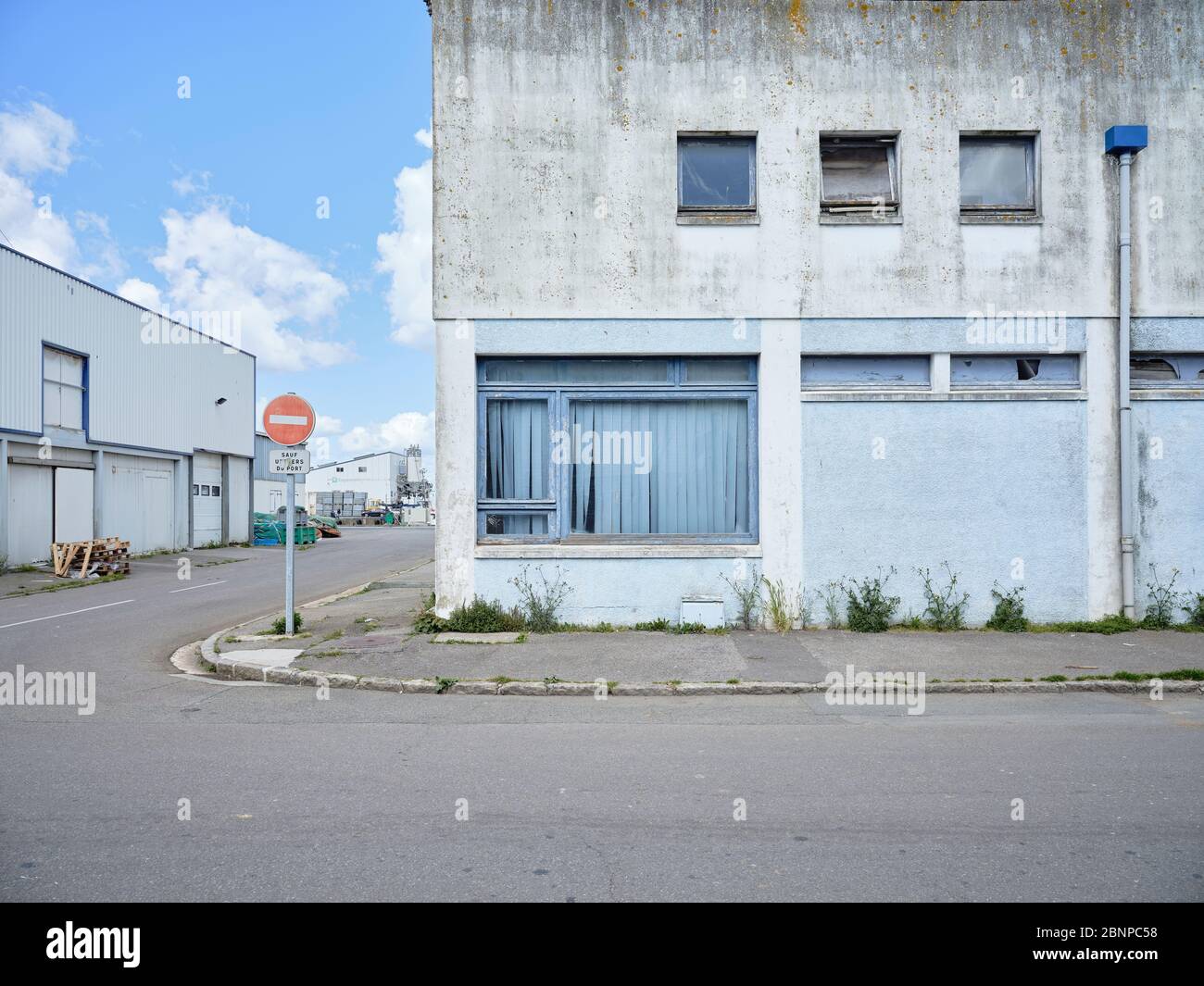 An abandoned warehouse at the port in Douarnenez in Brittany. Stock Photo