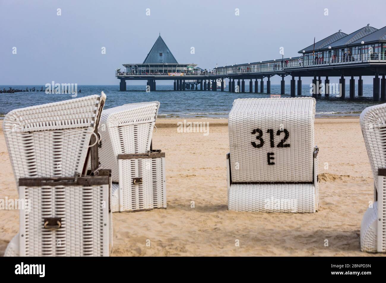 Germany, Mecklenburg-West Pomerania, Baltic Sea, Baltic Sea coast, Usedom Island, Heringsdorf, Seebad, pier, beach, beach chairs Stock Photo