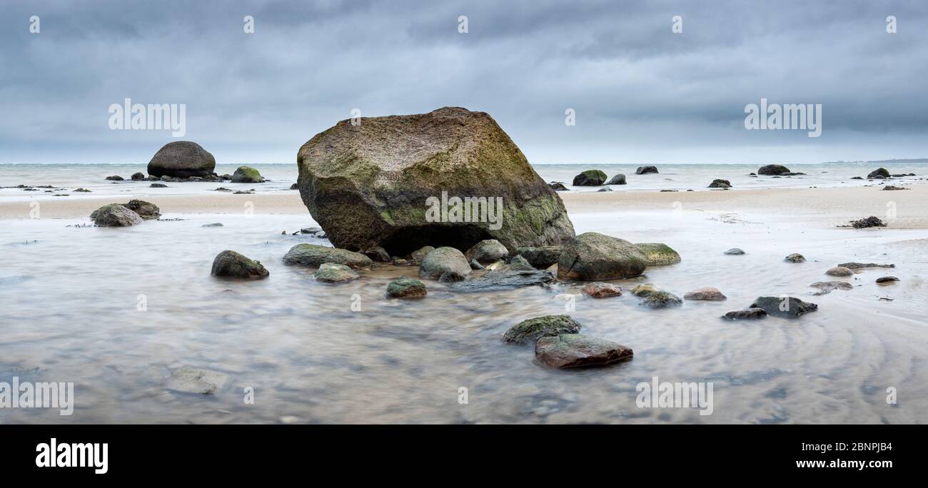 Panorama, sandy beach with boulders, stones on the beach of the Baltic Sea, cloudy sky, stormy sea, near Wismar, Mecklenburg-West Pomerania, Germany Stock Photo