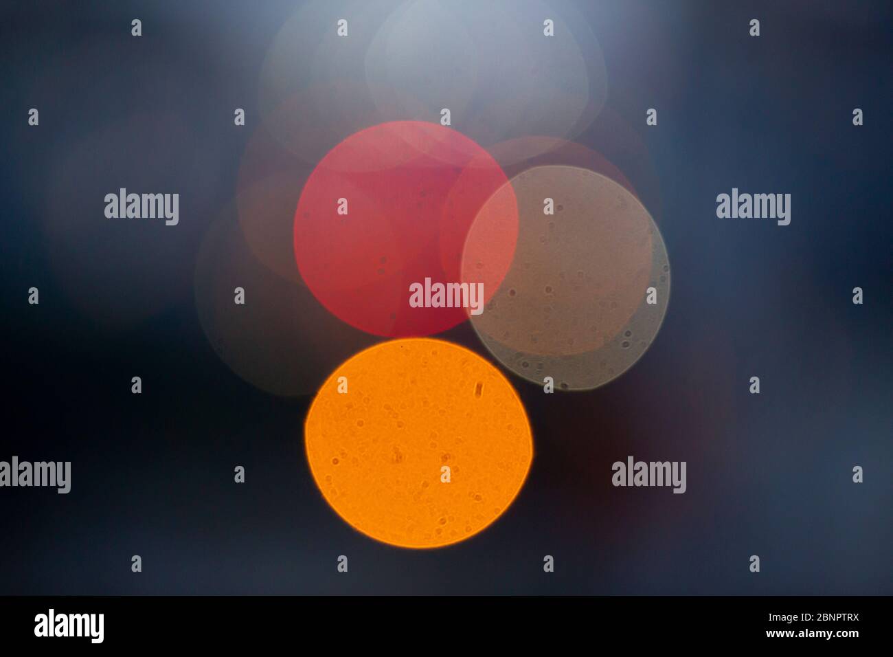 Colorful light bokeh moving on black background Stock Photo - Alamy