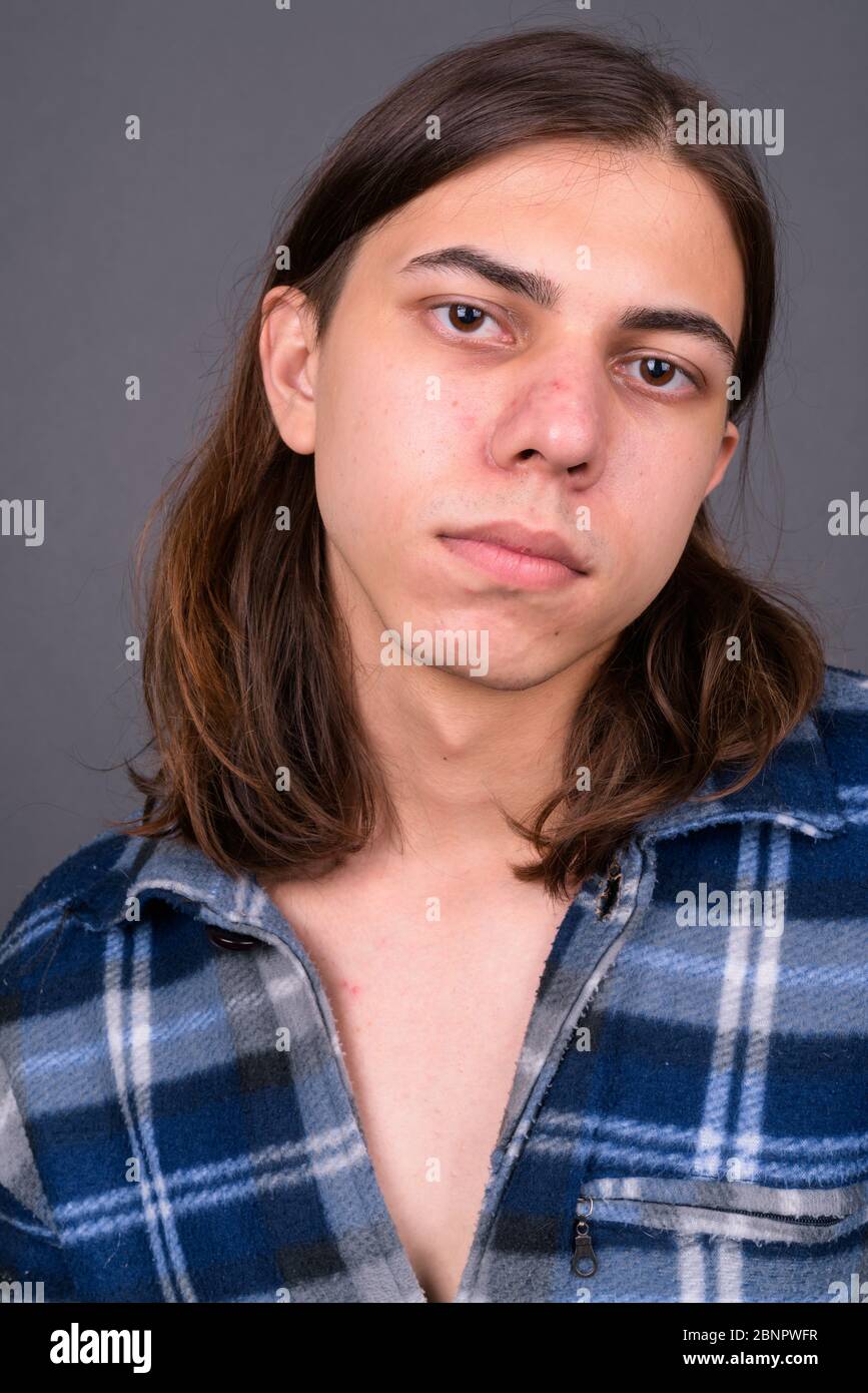 Handsome young man long hair hi-res stock photography and images - Alamy