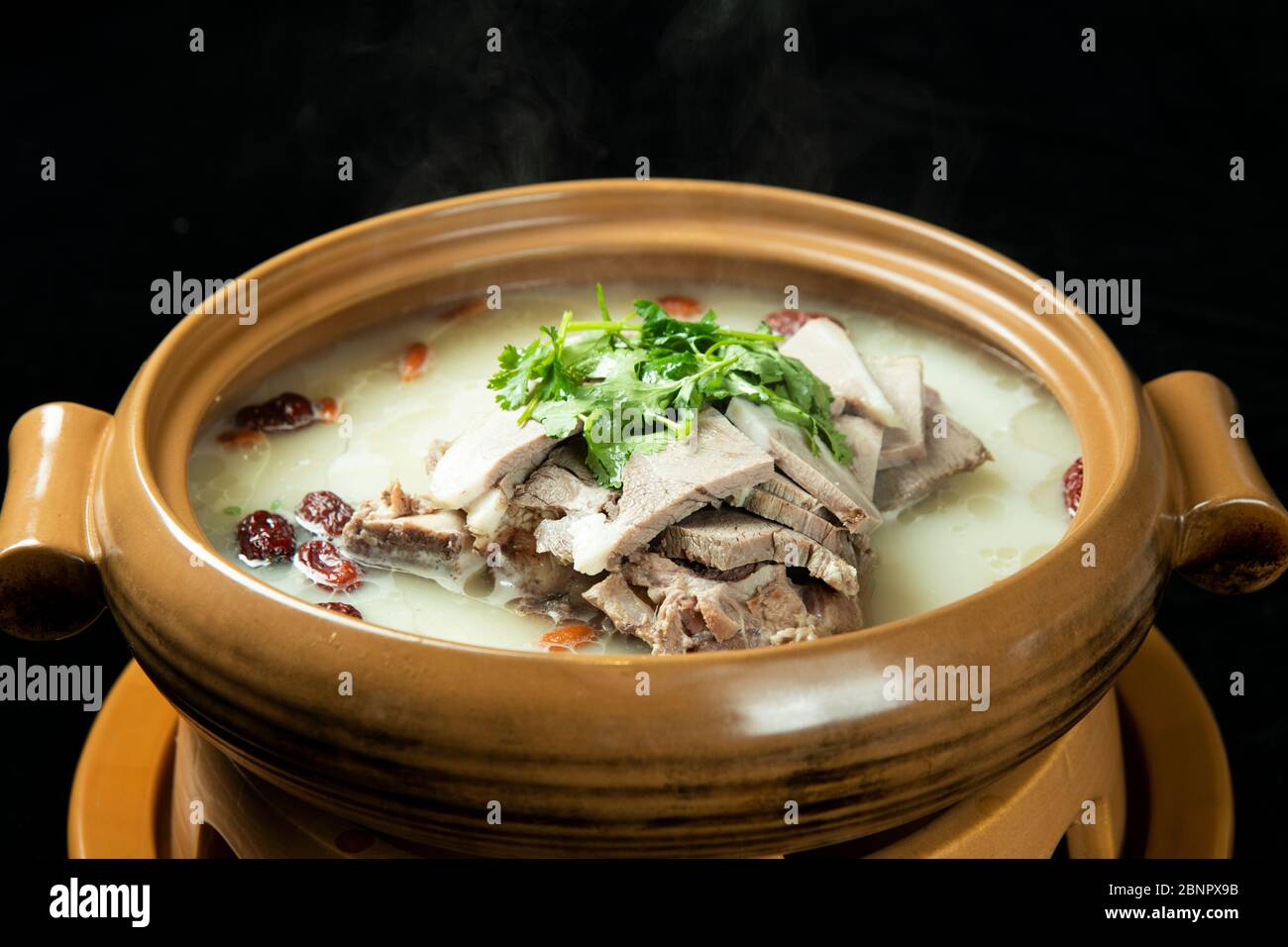 A pot of delicious Chinese mutton nourishing soup Stock Photo